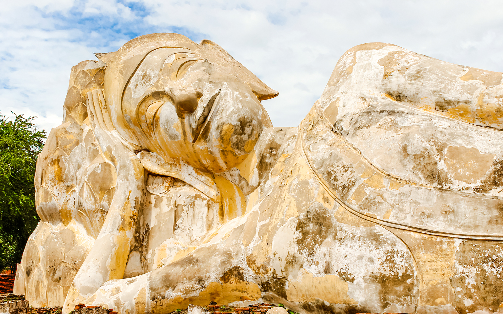 Reclining Buddha statue at Wat Lokayasutharam, Ayutthaya, Thailand.