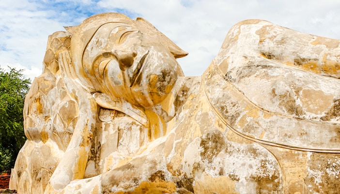 Reclining Buddha statue at Wat Lokayasutharam, Ayutthaya, Thailand.