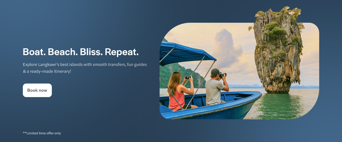 Tourists photographing limestone karst from a boat in Langkawi, Malaysia.