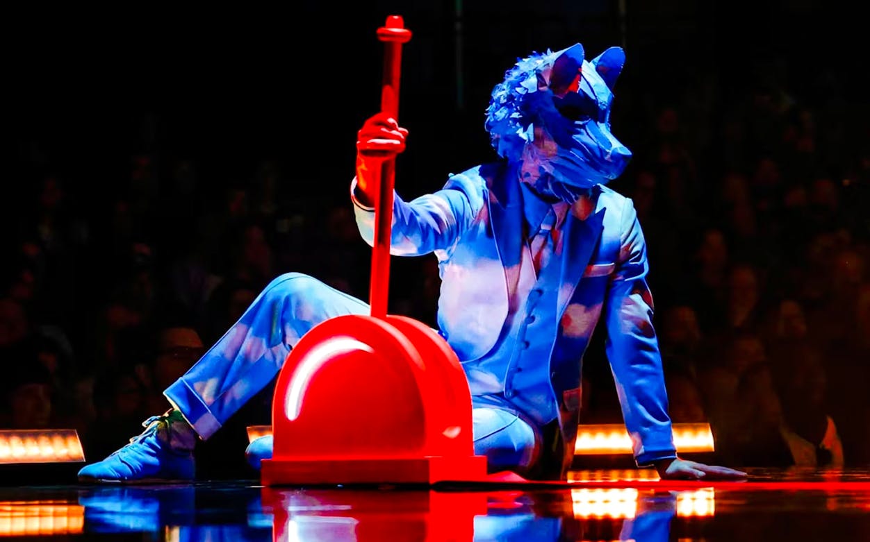 Performer in blue costume with animal mask at Cirque Du Soleil ECHO show.