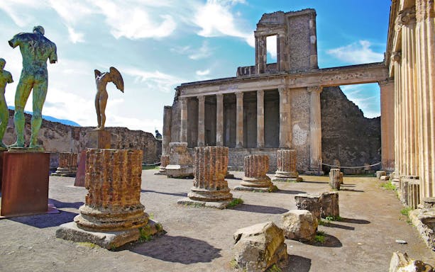 Ancient ruins and statues at Pompeii Archeological Park, Italy.