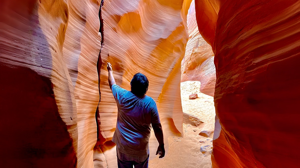 Visitor exploring Antelope Canyon during day tour
