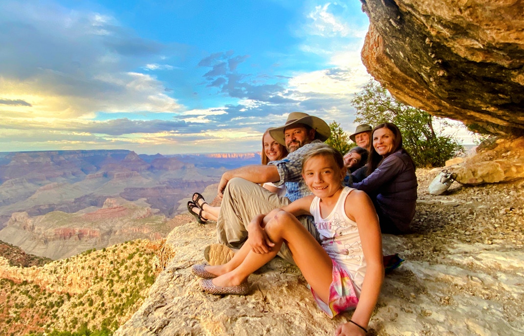 Guests seated, viewing Grand Canyon South Rim during 45-minute tour with optional Hummer experience.