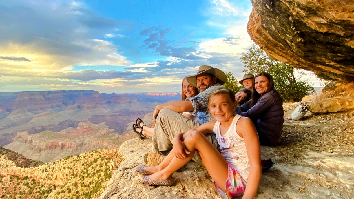 Guests seated, viewing Grand Canyon South Rim during 45-minute tour with optional Hummer experience.