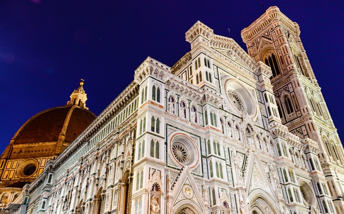 Florence Cathedral illuminated at night during E-Bike Night Tour from Piazzale Michelangelo.