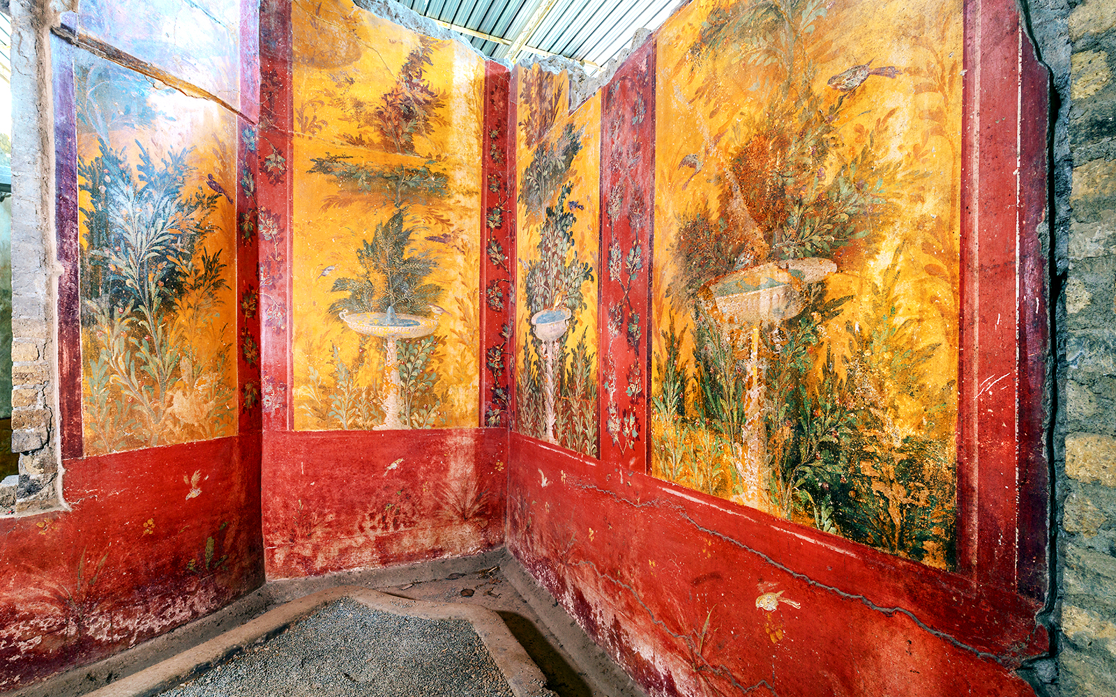 Oplontis villa frescoes with vibrant garden scenes on a small group tour.