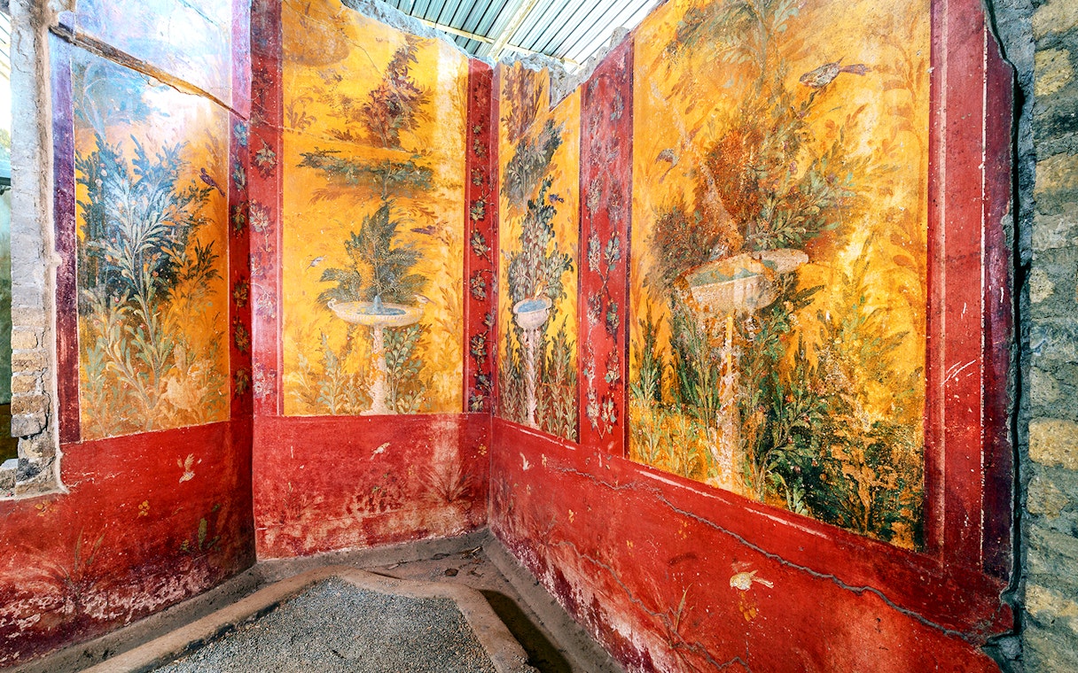 Oplontis villa frescoes with vibrant garden scenes on a small group tour.