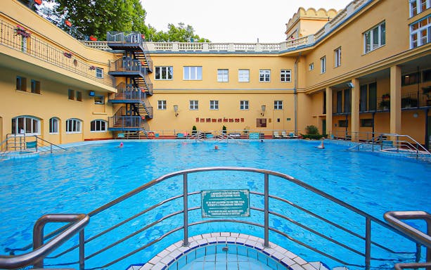 Lukacs Thermal Bath pool area in Budapest with surrounding historic architecture.