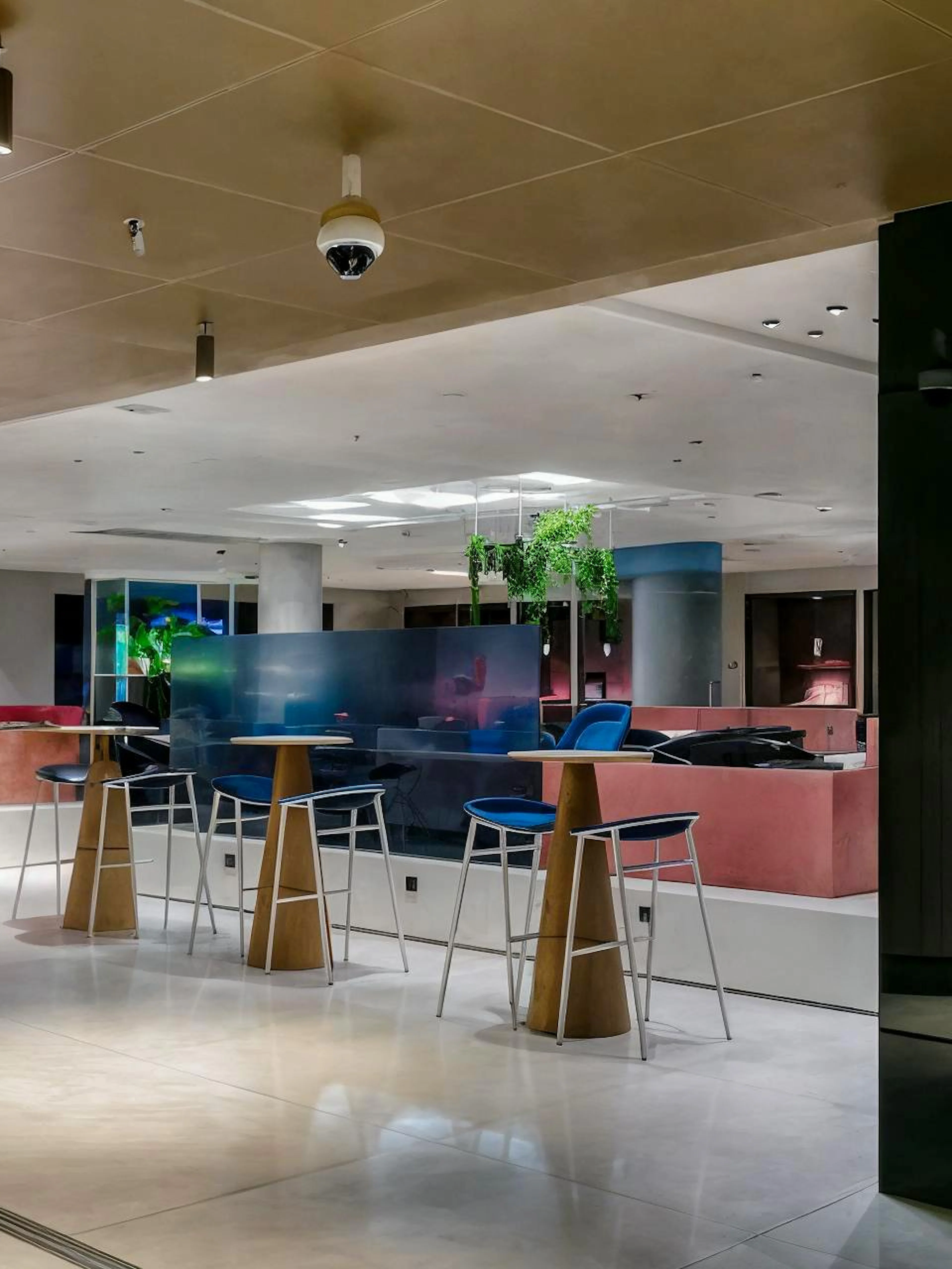 Aspire Lounge No.26 seating area with modern decor at Schiphol Airport.