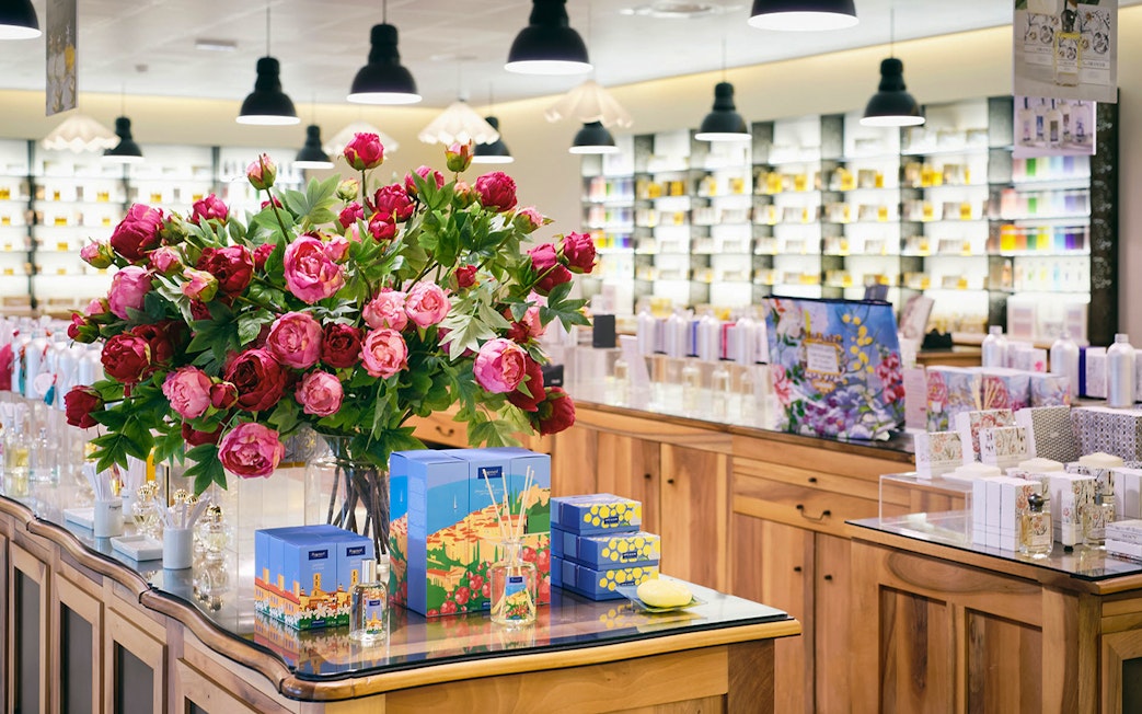 Fragonard Perfume Factory display with Flower of the Year eau de toilette and floral arrangement.