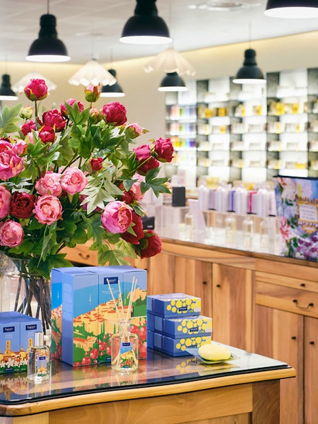 Fragonard Perfume Factory display with Flower of the Year eau de toilette and floral arrangement.