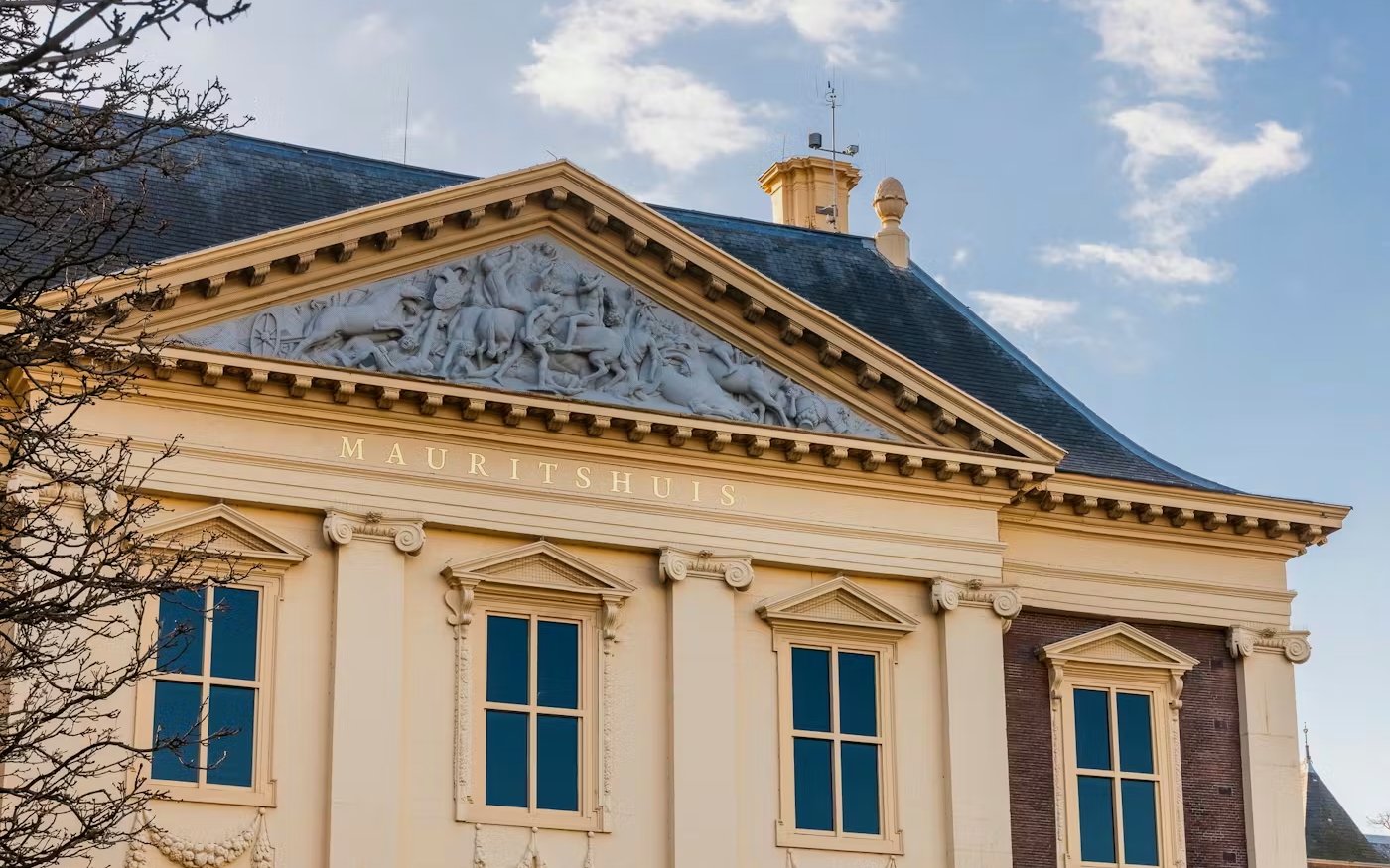 Mauritshuis museum facade with classical architecture and detailed frieze in The Hague.