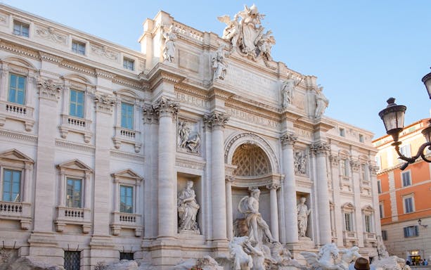 Trevi Fountain in Rome with intricate sculptures and baroque architecture.