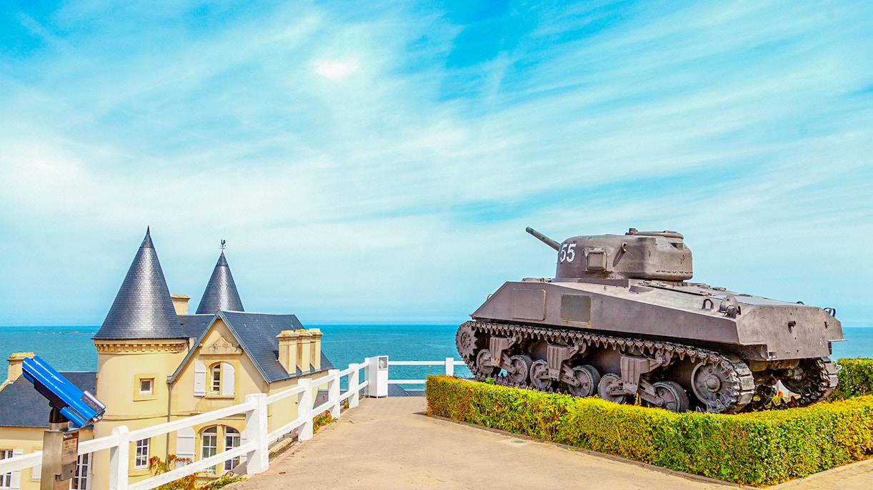 Old World War II tank overlooking the coast of Arromanches, Normandy.