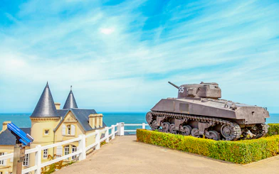 Old World War II tank overlooking the coast of Arromanches, Normandy.