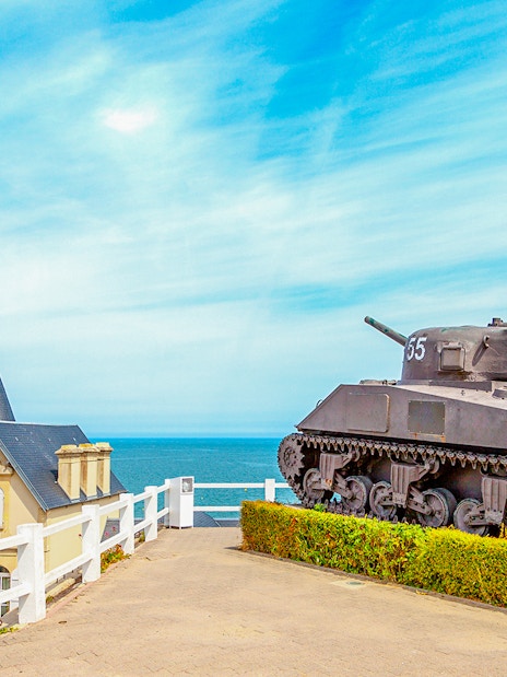 Old World War II tank overlooking the coast of Arromanches, Normandy.