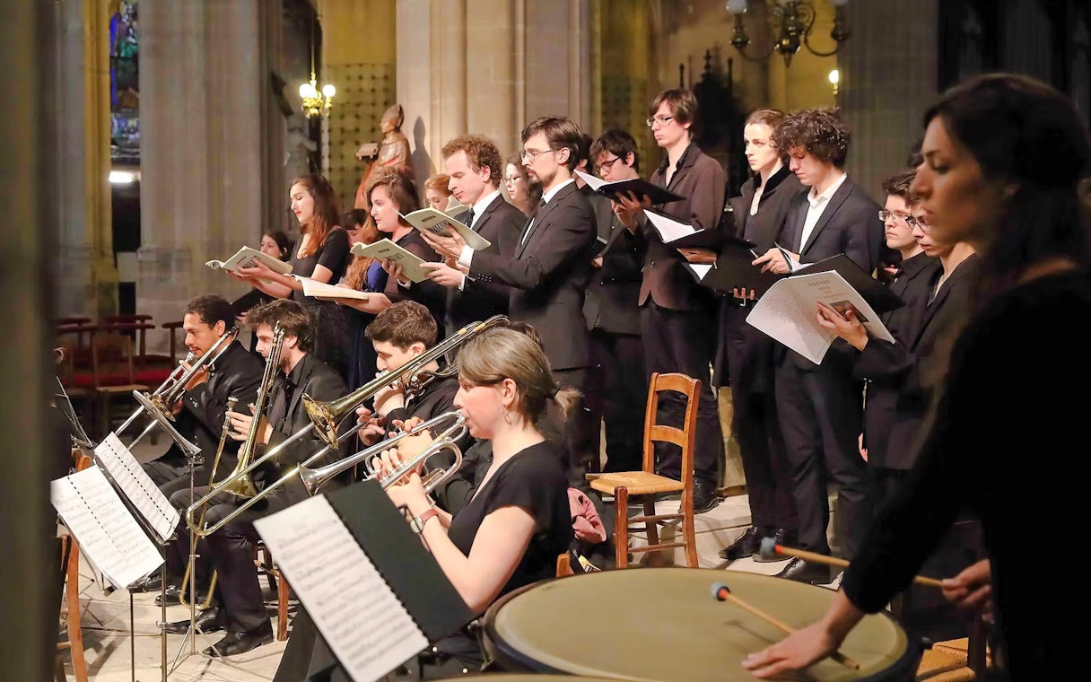 Choir and orchestra performing at Church of St Madeleine, Paris, France.
