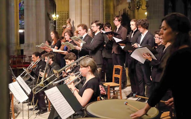 Choir and orchestra performing at Church of St Madeleine, Paris, France.