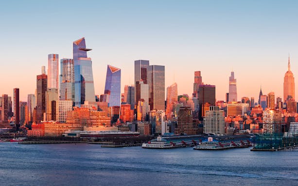 New York City skyline at sunset viewed from a helicopter tour.