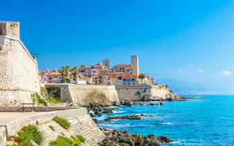 Old town of Antibes with stone walls and Mediterranean Sea in Provence, France.