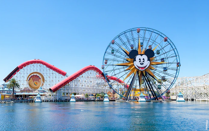 Ferris wheel and roller coaster at Paradise Pier, Disneyland Adventure Park, California.