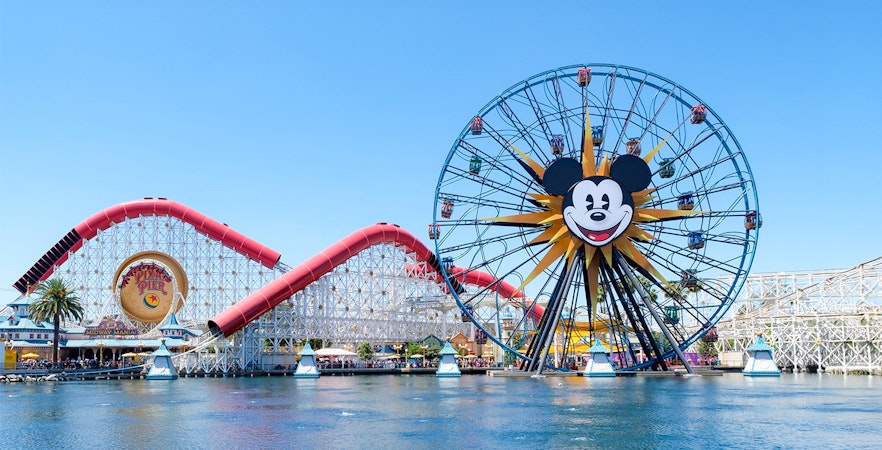 Ferris wheel and roller coaster at Paradise Pier, Disneyland Adventure Park, California.