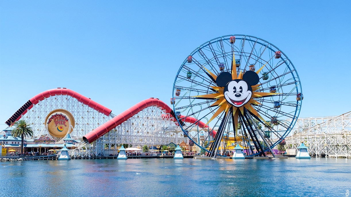 Ferris wheel and roller coaster at Paradise Pier, Disneyland Adventure Park, California.