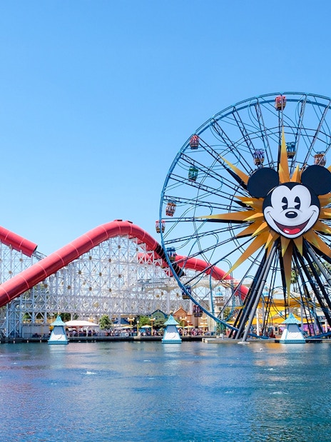 Ferris wheel and roller coaster at Paradise Pier, Disneyland Adventure Park, California.