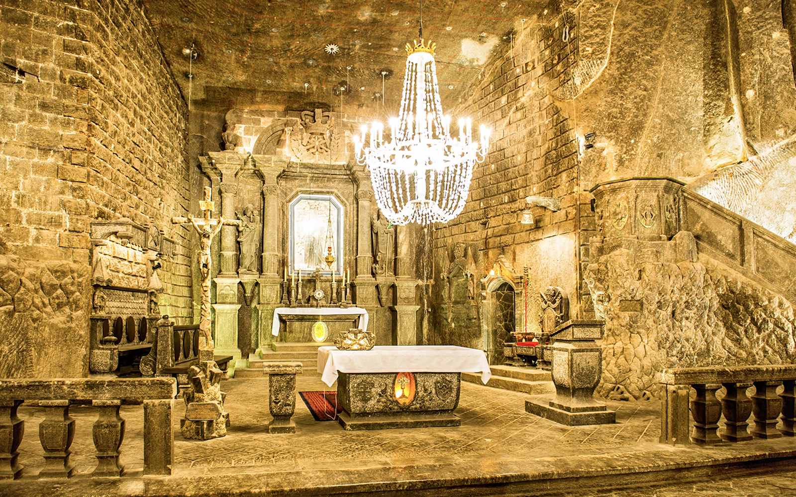 Wieliczka Salt Mine chapel interior with altar and chandelier.
