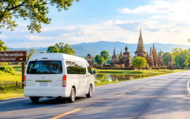 Private van on road to Sukhothai Historical Park, Chiang Mai.