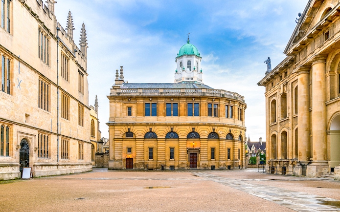 Sheldonian Theatre in Oxford with its distinctive dome and surrounding historic architecture.