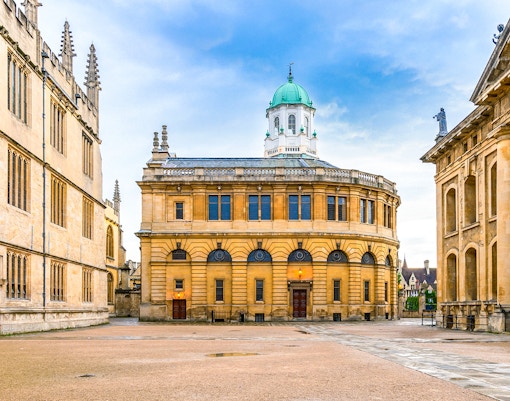 Sheldonian Theatre in Oxford with its distinctive dome and surrounding historic architecture.