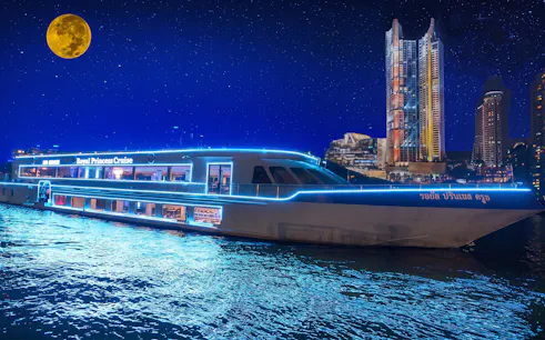 Royal Princess Cruise ship illuminated at night with city skyline and full moon.