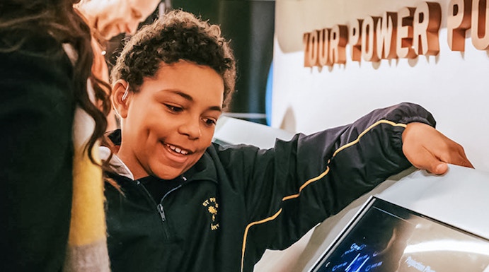 Visitors interacting with a digital display at Lift 109 exhibit.
