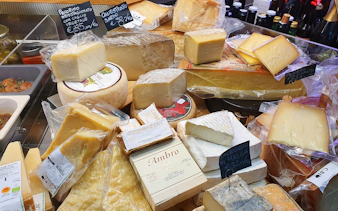 Assorted Italian cheeses on display at a Florence market during a food tour.