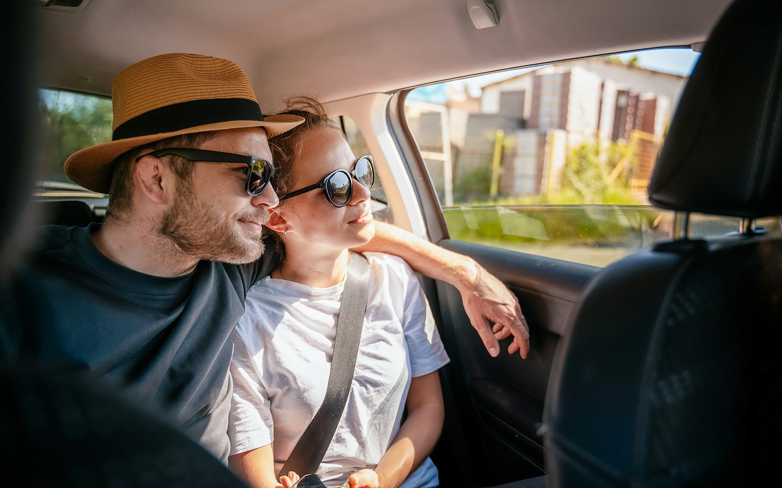 Couple in car during Tokyo to Kamakura day tour transfer.