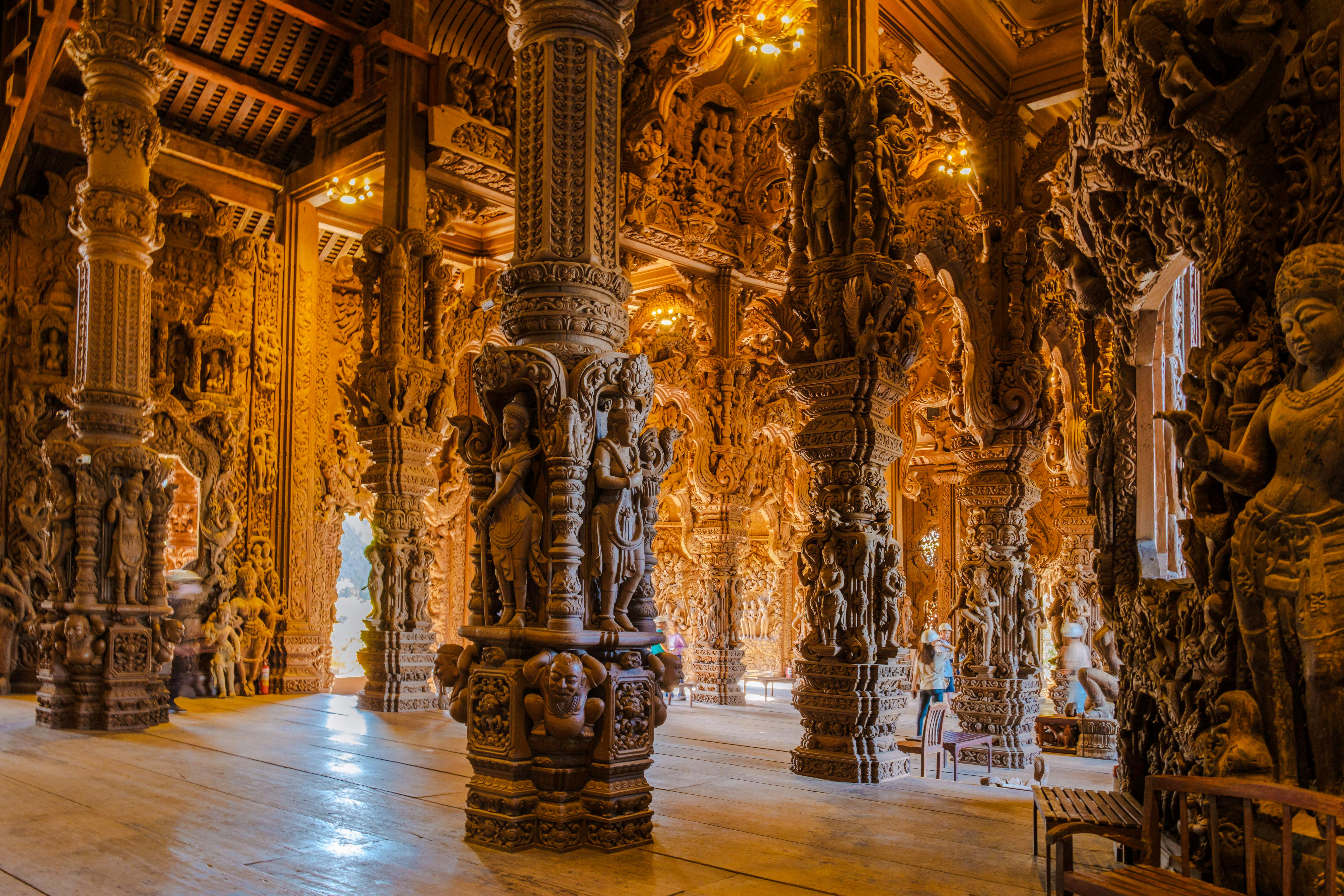Sanctuary of Truth interior with intricate wooden carvings, Pattaya city tour.