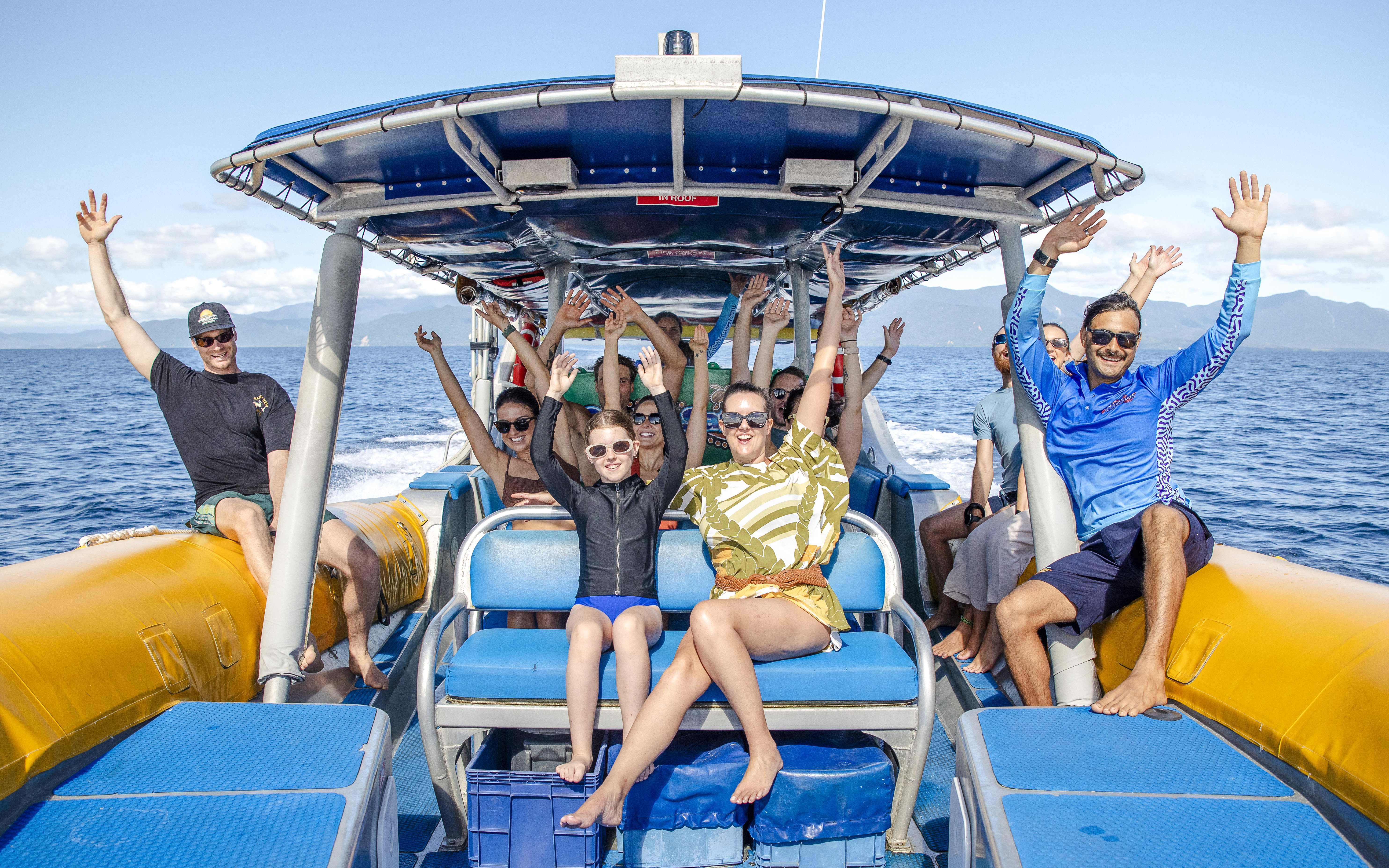 Group enjoying a boat ride on the Great Barrier Reef guided snorkel and eco tour.