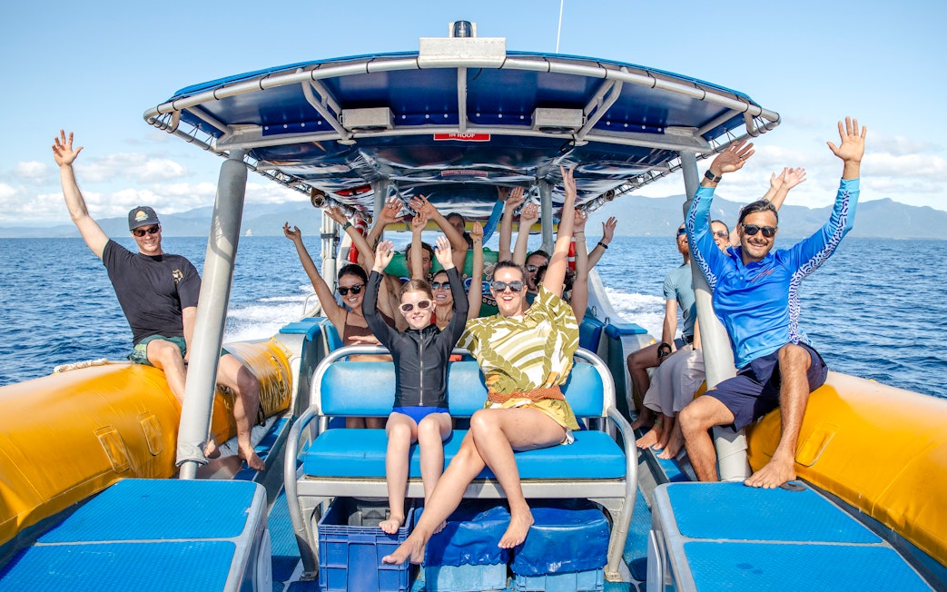 Group enjoying a boat ride on the Great Barrier Reef guided snorkel and eco tour.