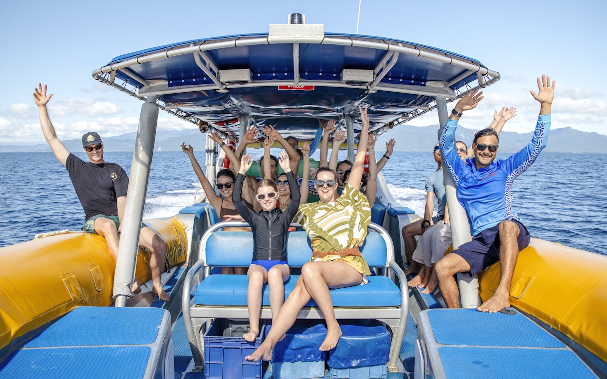 Group enjoying a boat ride on the Great Barrier Reef guided snorkel and eco tour.