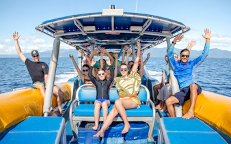 Group enjoying a boat ride on the Great Barrier Reef guided snorkel and eco tour.