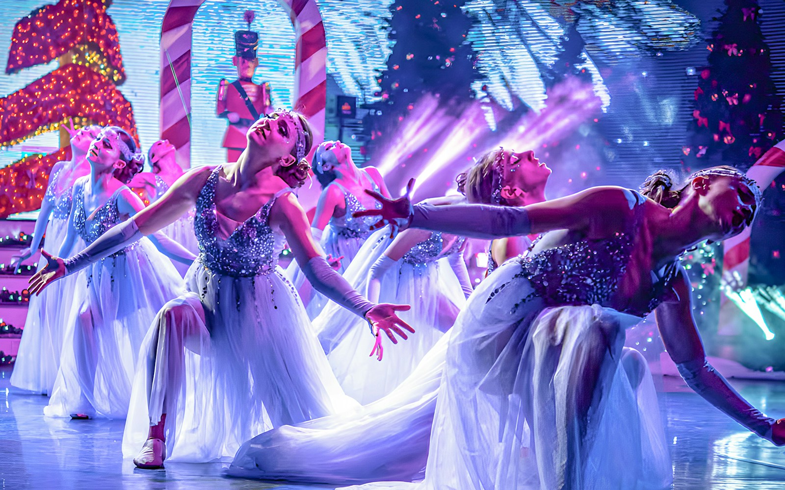 PortAventura Christmas show performers in festive costumes during Christmas Dream event in Spain.