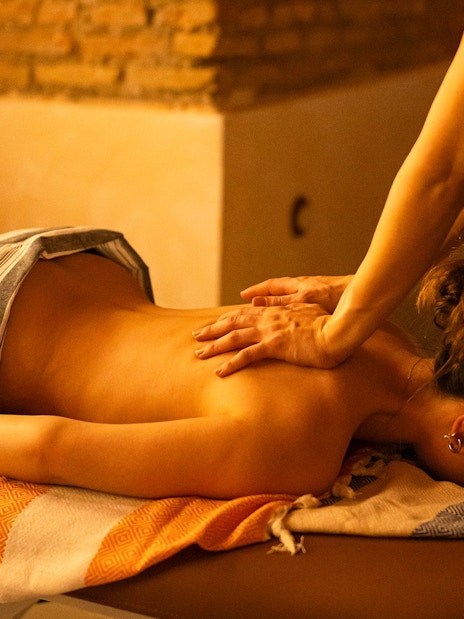 Visitors receiving Traditional Hammam massage in Granada spa.