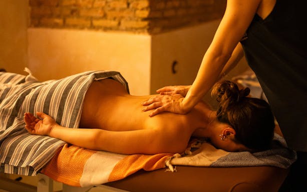 Visitors receiving Traditional Hammam massage in Granada spa.