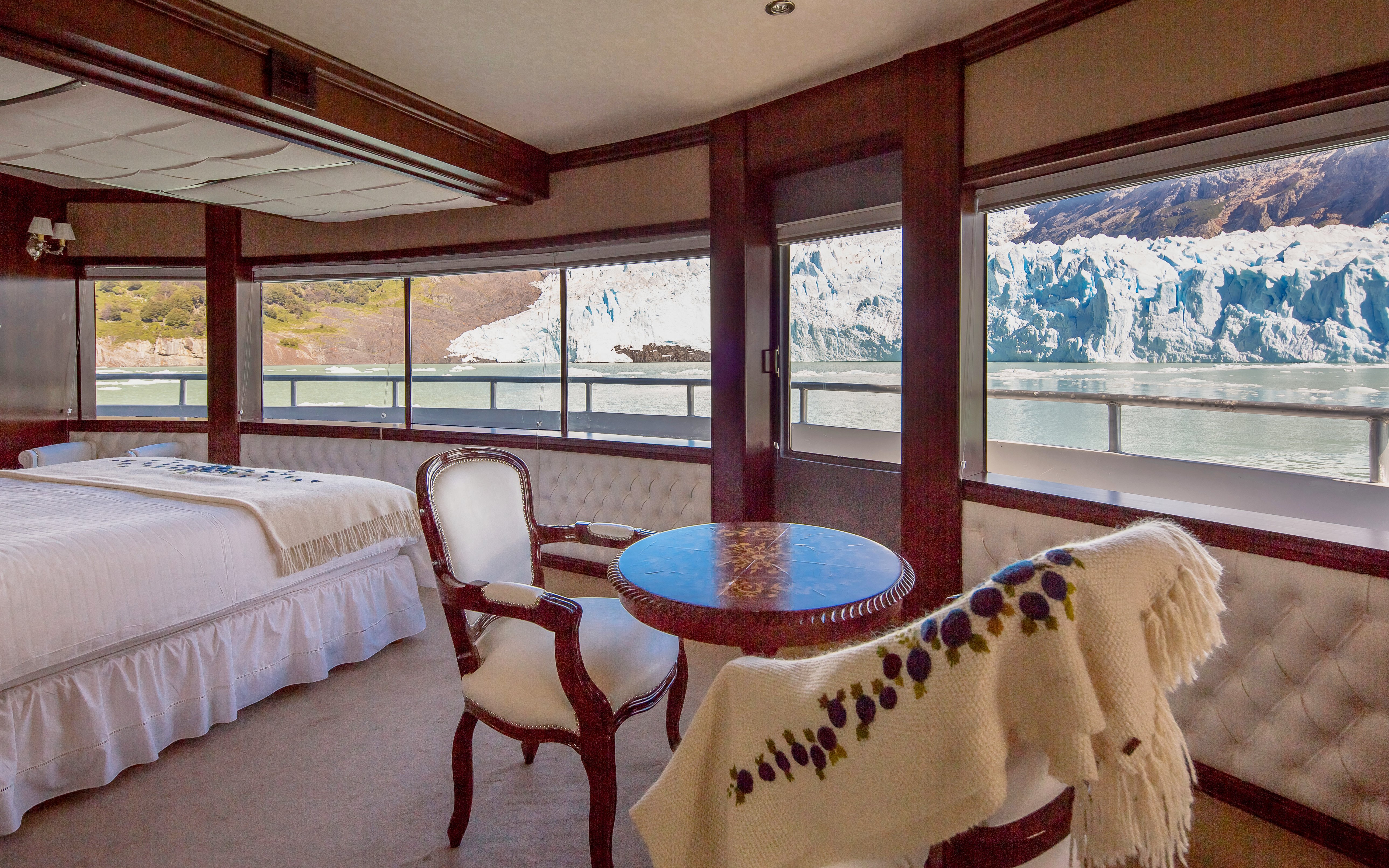 Cabin interior with glacier view on Spirit of the Glaciers tour boat.
