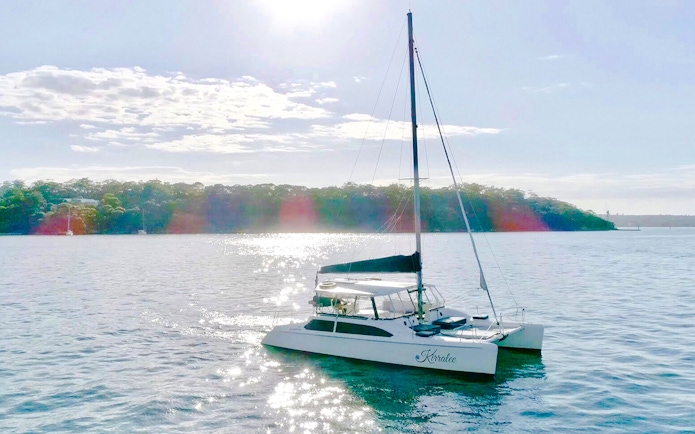 Luxury catamaran on Sydney Harbour during Vivid Sydney cruise.