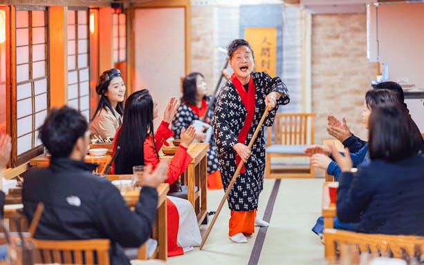 Tokyo dinner cruise with traditional performance during cherry blossom season.