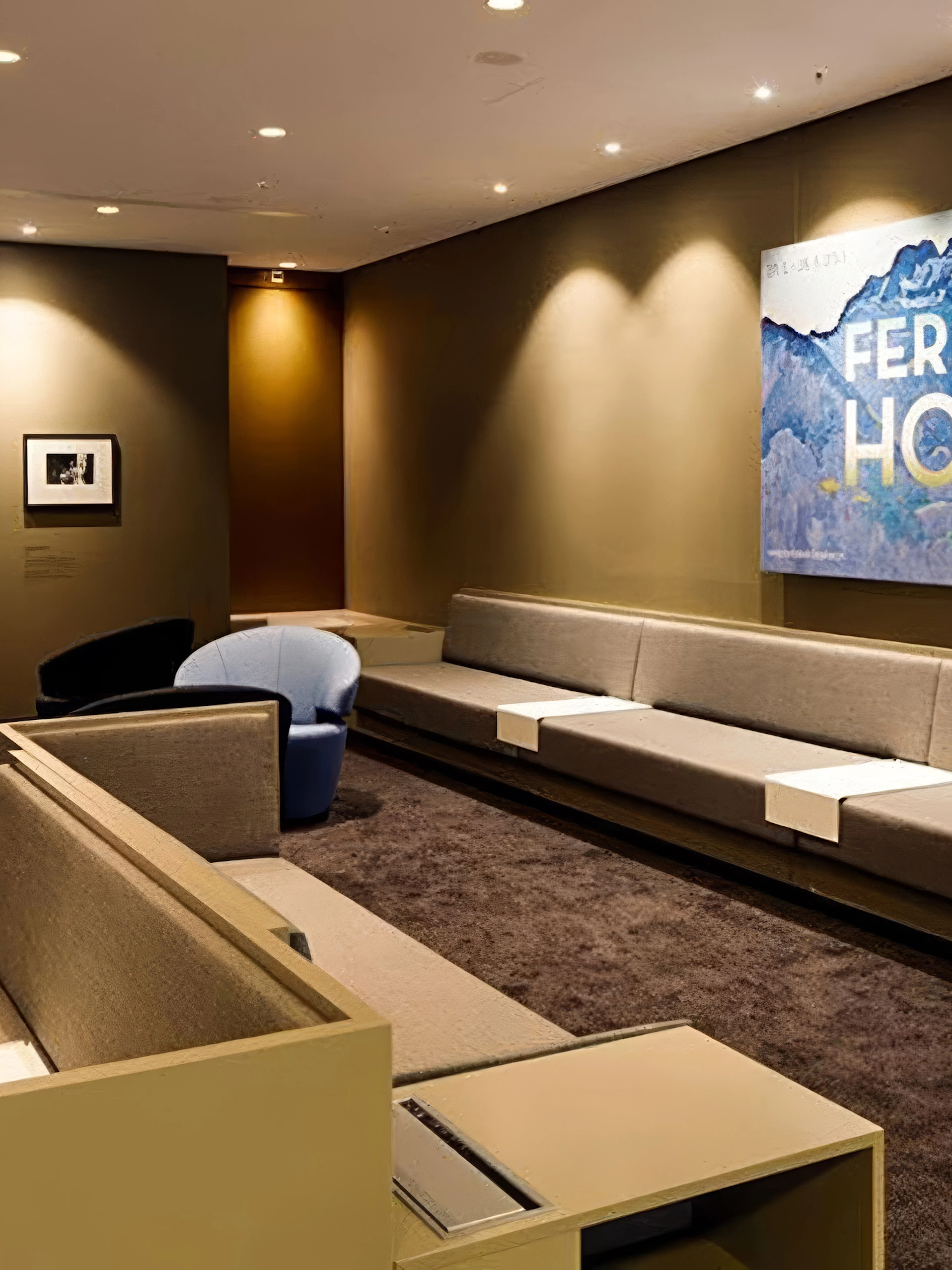 Aspire ONE Lounge seating area with artwork at Zurich Airport, Airside Centre, T1.