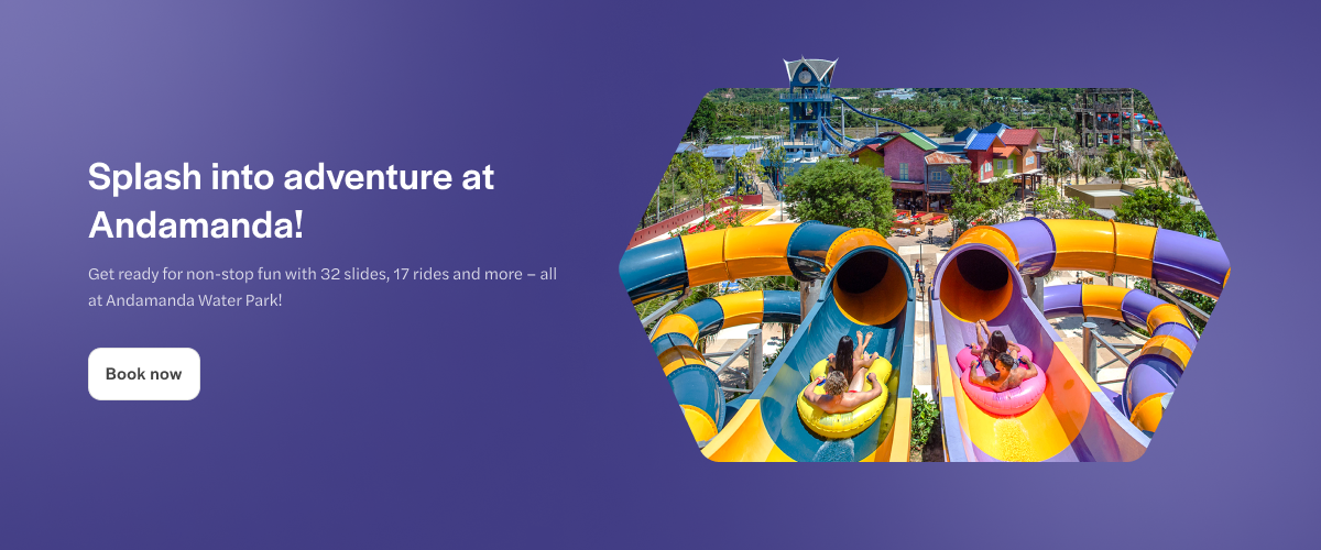 Andamanda Water Park slides with people on inflatable tubes, Phuket, Thailand.