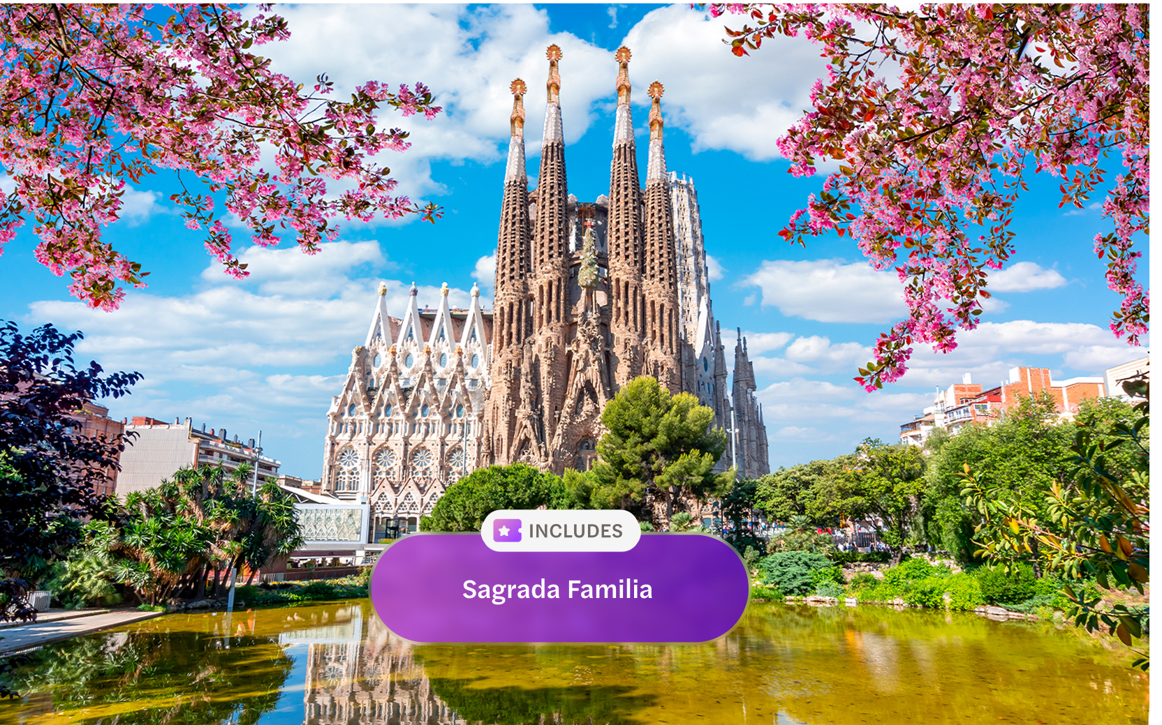 Sagrada Familia in Barcelona with blooming trees and reflection in pond.
